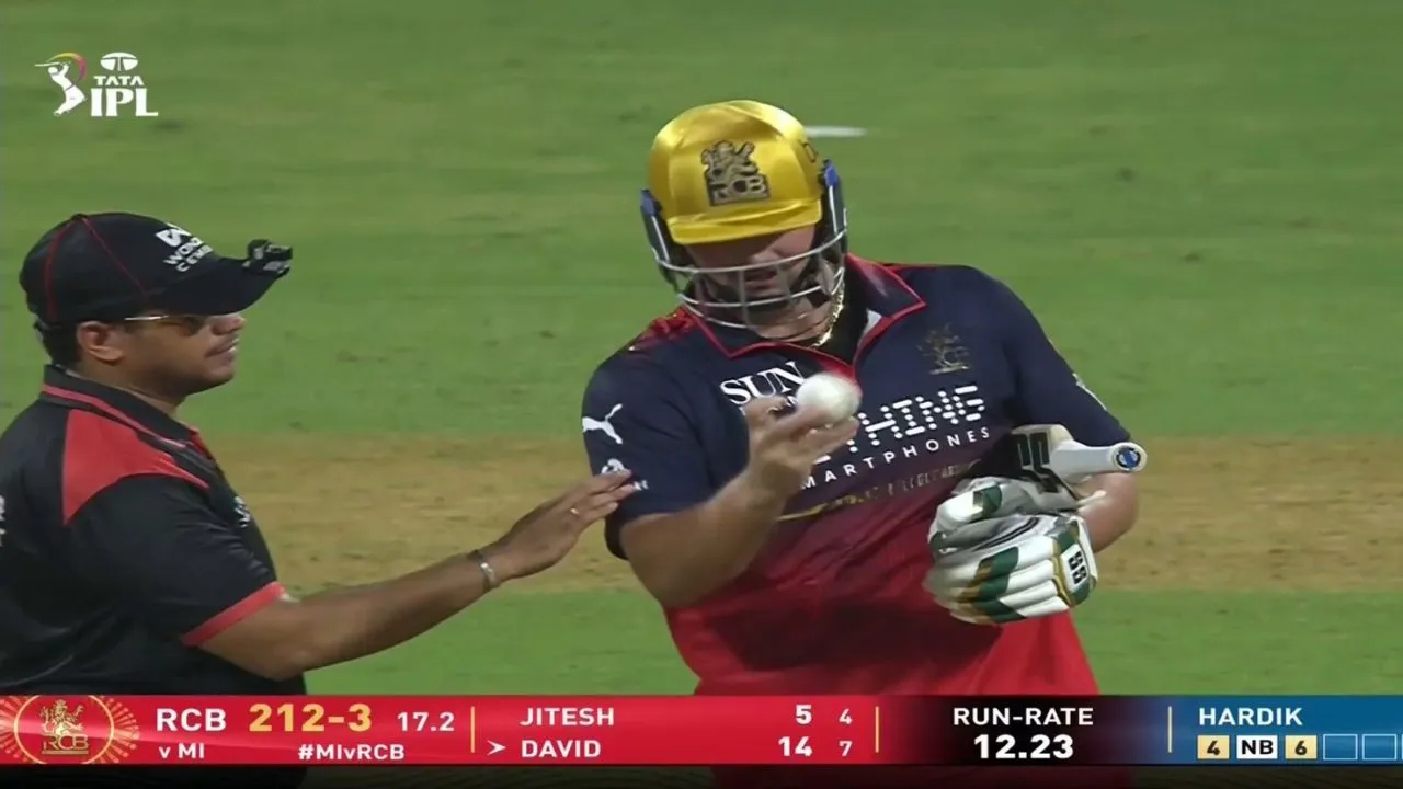 Tim David checks the shape of ball, gets warning in MI vs RCB Clash
